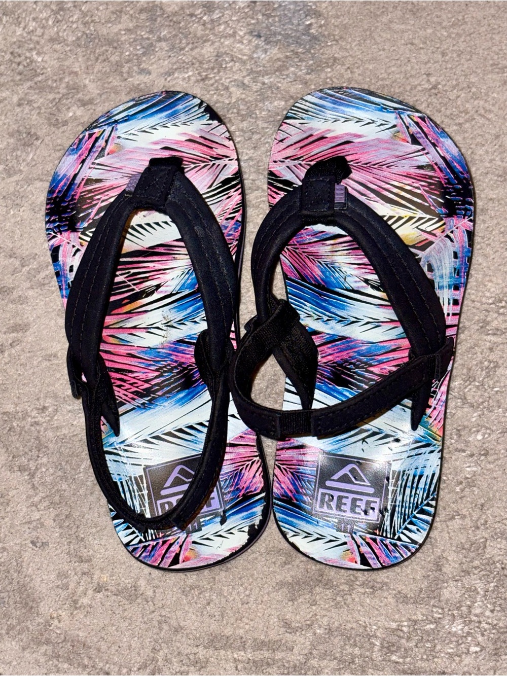 Reef Lil Ahi Toddler Black Sandals with Pink, Blue & Purple Tropical Print